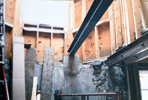 Image 12 - What used to be the men’s shower on a landing next to the original 1890’s stair was removed and new steel was installed to carry the grand stair and landings.